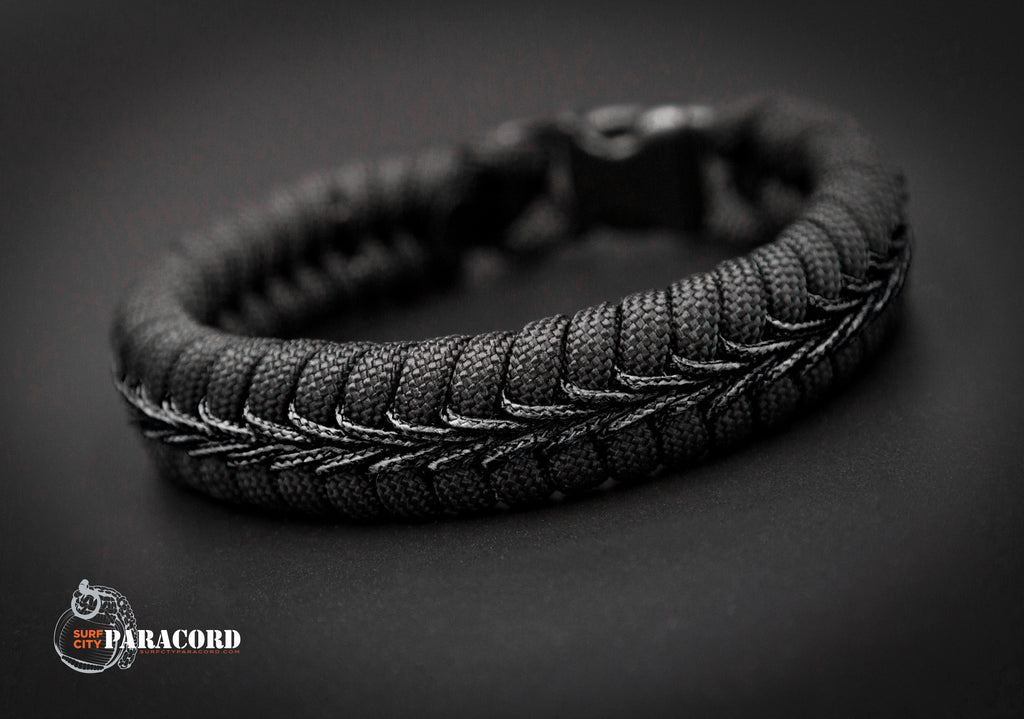 Back in Black Paracord Fishtail Bracelet with Black Center Stitch. 7 / Plastic Buckle - Included