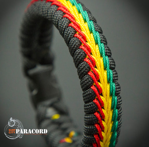 Paracord Rasta Fishtail Bracelet with Red Yellow and Green Stitching. Surf City Paracord Inc